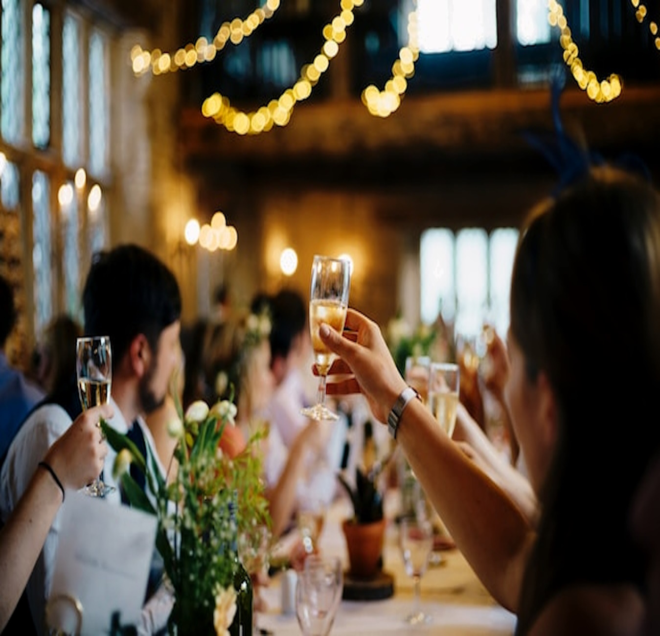 group of friends celebrating over drinks